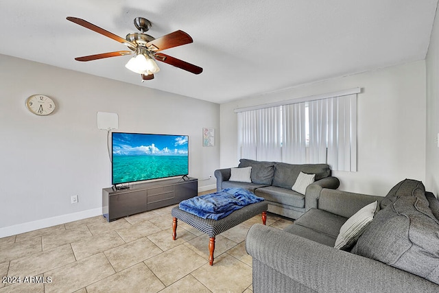 tiled living room featuring ceiling fan