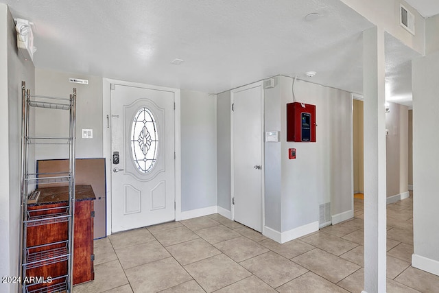 entryway with light tile flooring