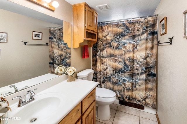 bathroom featuring toilet, tile patterned floors, a shower with shower curtain, and vanity