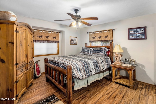 bedroom featuring wood-type flooring and ceiling fan