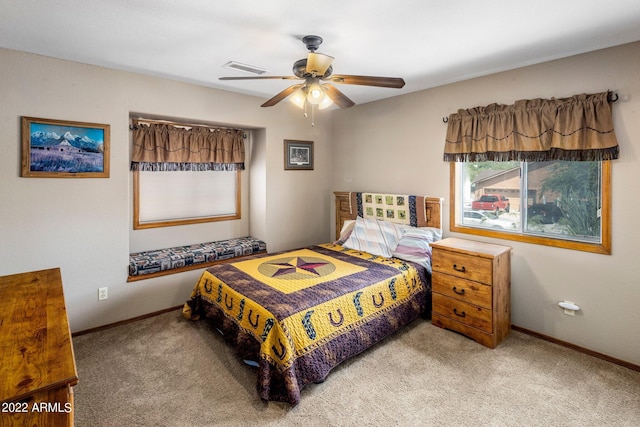 bedroom featuring ceiling fan and light colored carpet