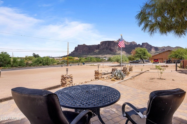 view of patio / terrace featuring a mountain view