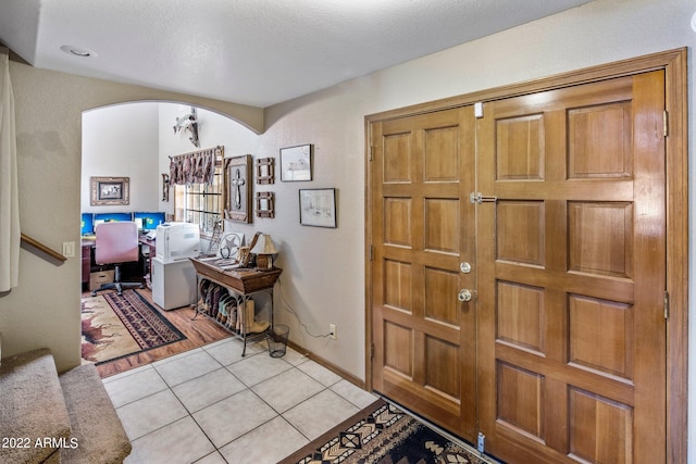 foyer with light tile patterned floors