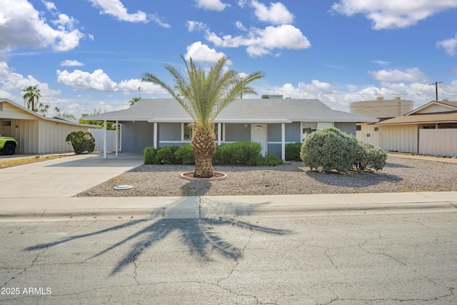 single story home featuring a carport