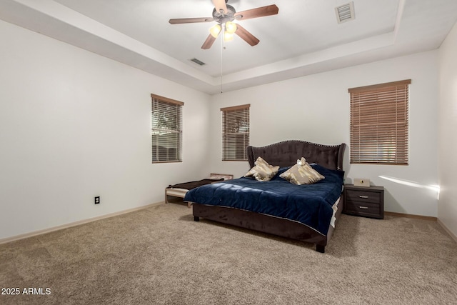 3438 W Little Hopi Dr, Phoenix, AZ 85086 - bedroom with a tray ceiling, carpet floors, baseboards, and a ceiling fan