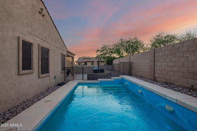 3438 W Little Hopi Dr, Phoenix, AZ 85086 - pool at dusk featuring a fenced backyard