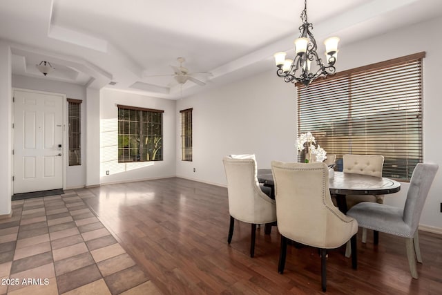 3438 W Little Hopi Dr, Phoenix, AZ 85086 - dining room featuring a raised ceiling, a ceiling fan, wood finished floors, a chandelier, and baseboards
