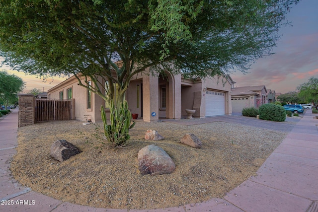3438 W Little Hopi Dr, Phoenix, AZ 85086 - view of front of house with stucco siding, a garage, and driveway