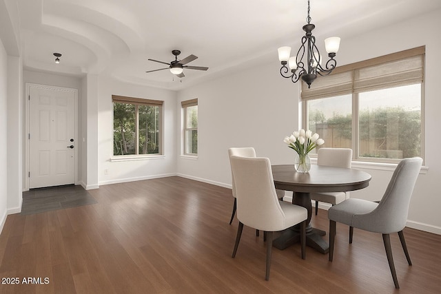 3438 W Little Hopi Dr, Phoenix, AZ 85086 - dining space with a chandelier, baseboards, dark wood-style floors, and ceiling fan