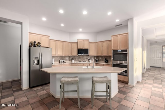 3438 W Little Hopi Dr, Phoenix, AZ 85086 - kitchen with appliances with stainless steel finishes, a sink, light brown cabinetry, light countertops, and recessed lighting