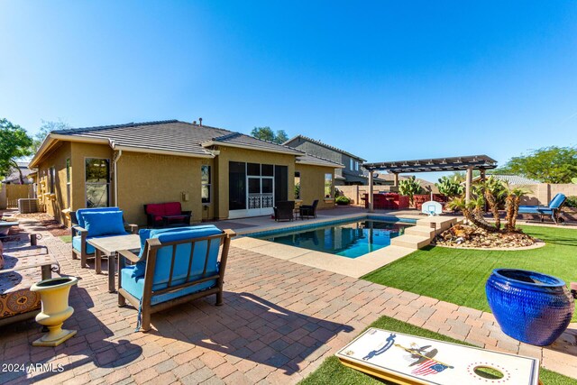 view of pool with a pergola, a lawn, a patio, and an outdoor hangout area