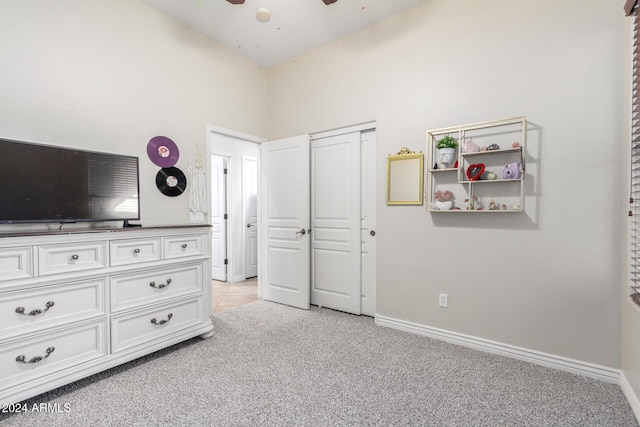 carpeted bedroom featuring a towering ceiling