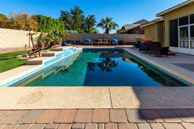 view of swimming pool featuring an outdoor living space and a patio