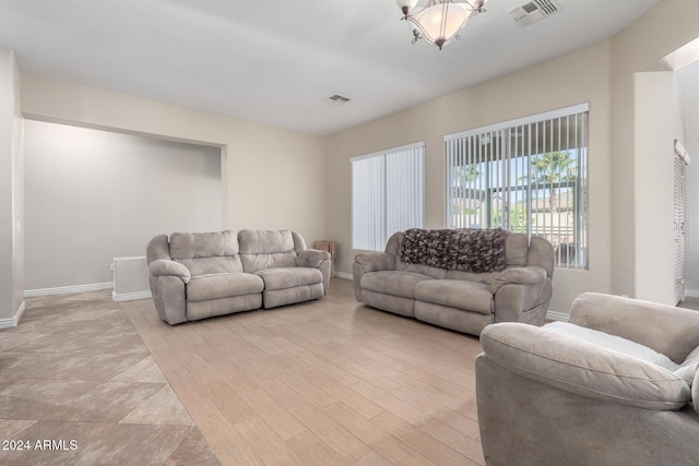 living room with light hardwood / wood-style floors