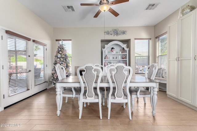 dining room featuring light hardwood / wood-style flooring and ceiling fan