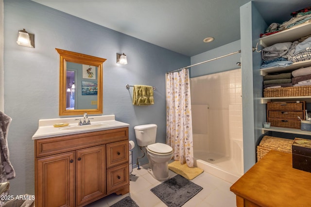 bathroom with toilet, vanity, tile patterned floors, and a shower with curtain