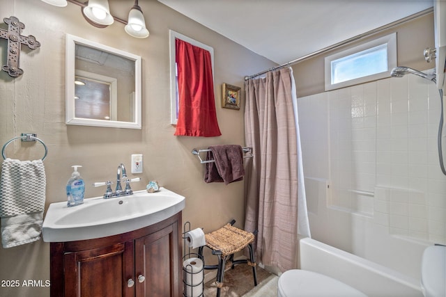 full bathroom with shower / tub combo, vanity, and toilet