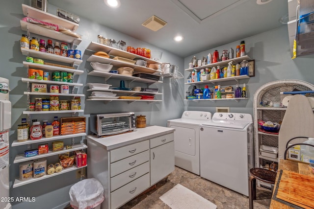 clothes washing area with separate washer and dryer