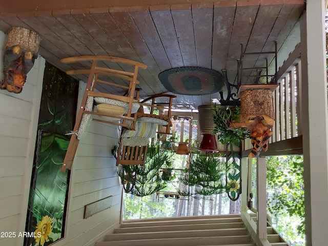 room details featuring wood ceiling and wood walls