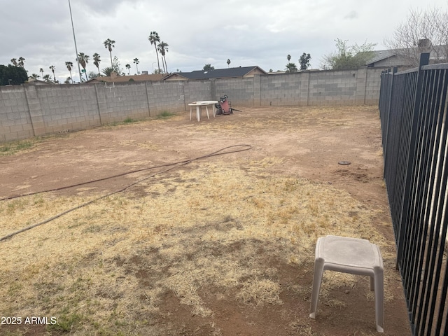 view of yard featuring a fenced backyard