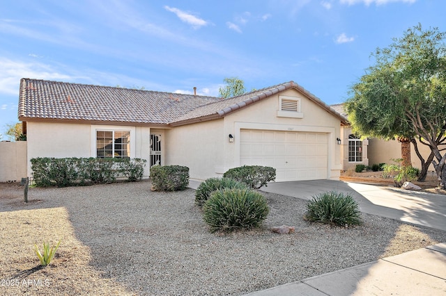 ranch-style home featuring a garage