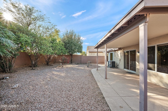 view of yard featuring a patio and central air condition unit