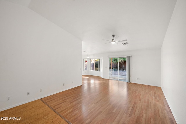 spare room with light hardwood / wood-style flooring and ceiling fan with notable chandelier