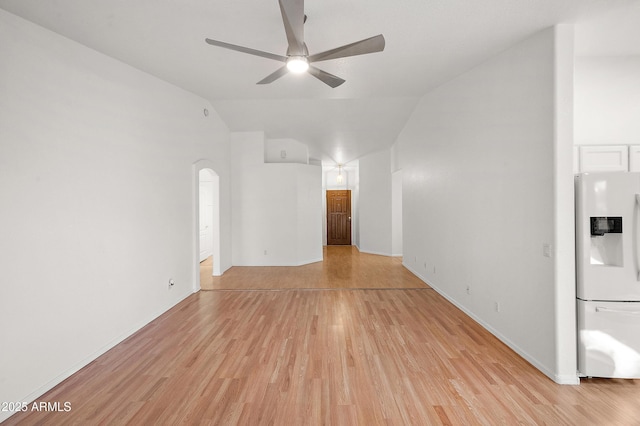 unfurnished living room featuring ceiling fan, lofted ceiling, and light hardwood / wood-style flooring