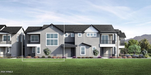 view of front of house featuring a mountain view and a front yard