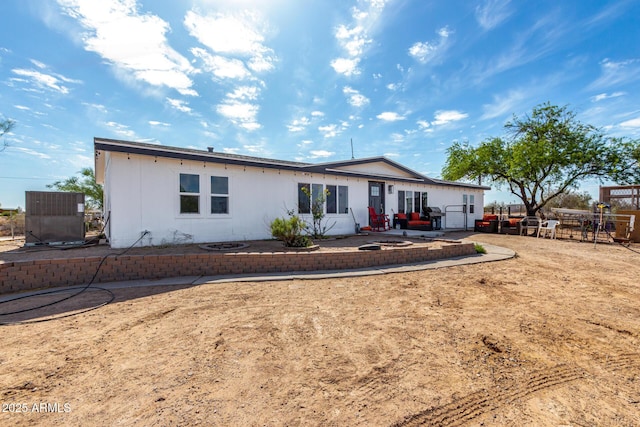 back of house featuring a patio area and central AC