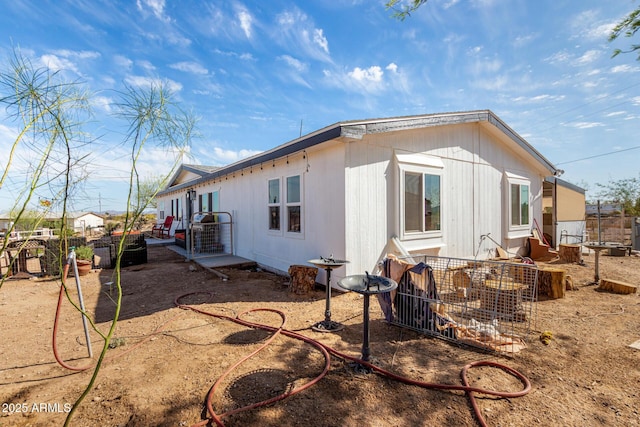 view of side of home with fence