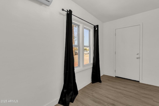 spare room featuring light wood-type flooring