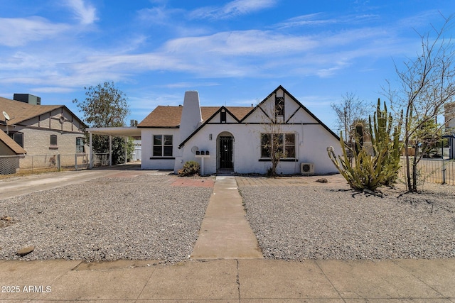 tudor-style house with a carport