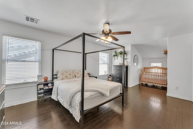 bedroom featuring dark hardwood / wood-style flooring and ceiling fan