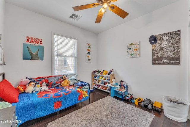 bedroom featuring dark hardwood / wood-style flooring and ceiling fan