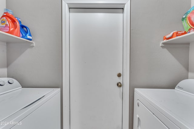 laundry area featuring washing machine and clothes dryer