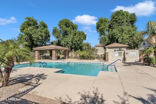 view of swimming pool featuring a patio area