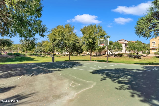 view of basketball court featuring a yard