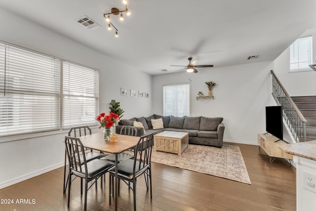 dining space featuring dark wood-type flooring, plenty of natural light, and ceiling fan