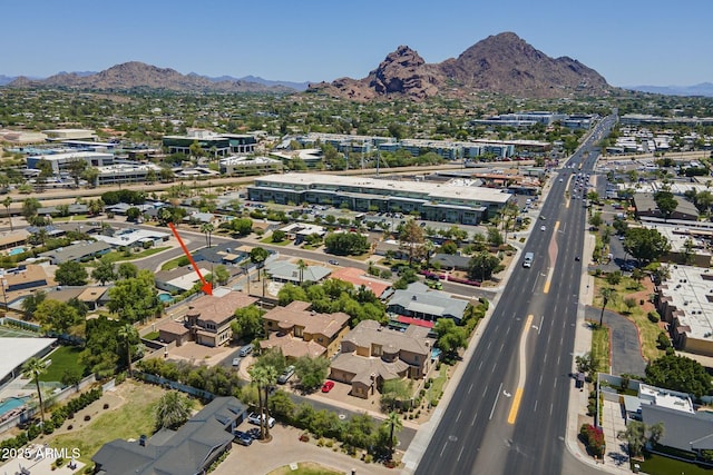 3812 E Camelback Rd, Phoenix, AZ 85018 - aerial overview of property's location featuring a mountainous background and nearby suburban area