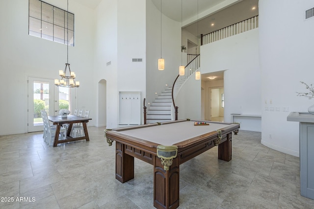 3812 E Camelback Rd, Phoenix, AZ 85018 - rec room featuring a towering ceiling, baseboards, a chandelier, arched walkways, and pool table