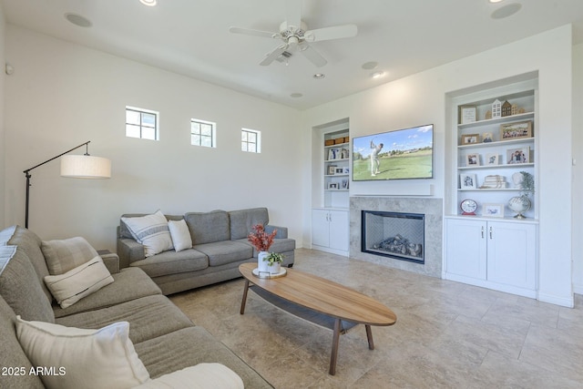 3812 E Camelback Rd, Phoenix, AZ 85018 - living area with built in features, a fireplace, a ceiling fan, and recessed lighting