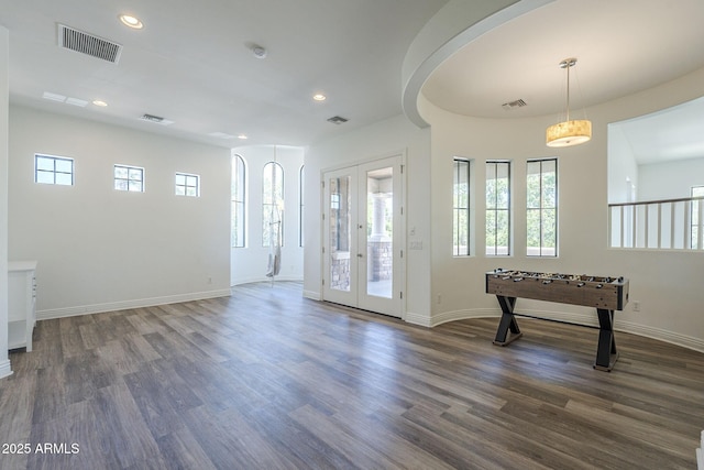 3812 E Camelback Rd, Phoenix, AZ 85018 - foyer entrance with plenty of natural light, wood finished floors, recessed lighting, and french doors