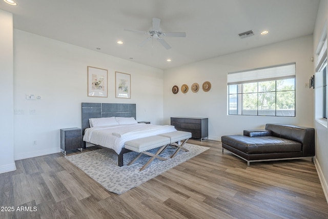 3812 E Camelback Rd, Phoenix, AZ 85018 - bedroom with wood finished floors, recessed lighting, baseboards, and a ceiling fan