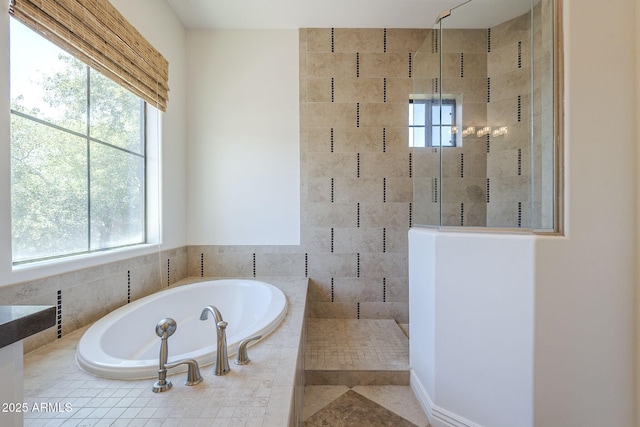 3812 E Camelback Rd, Phoenix, AZ 85018 - bathroom featuring plenty of natural light, a garden tub, and a tile shower