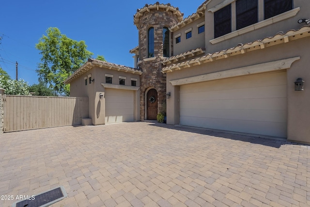 3812 E Camelback Rd, Phoenix, AZ 85018 - mediterranean / spanish-style home featuring stucco siding, decorative driveway, and a tile roof