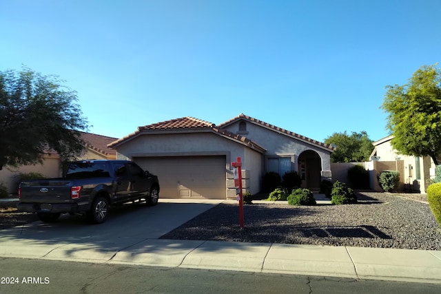 mediterranean / spanish-style home featuring a garage