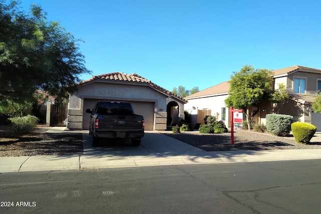 mediterranean / spanish-style home featuring a garage