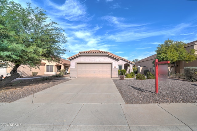 mediterranean / spanish-style home featuring a garage