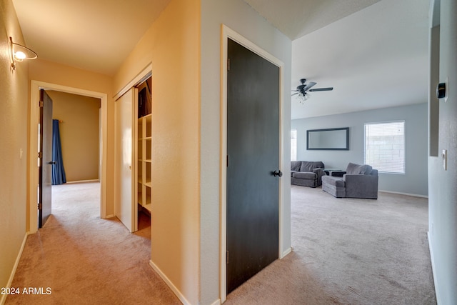 corridor featuring carpet and baseboards